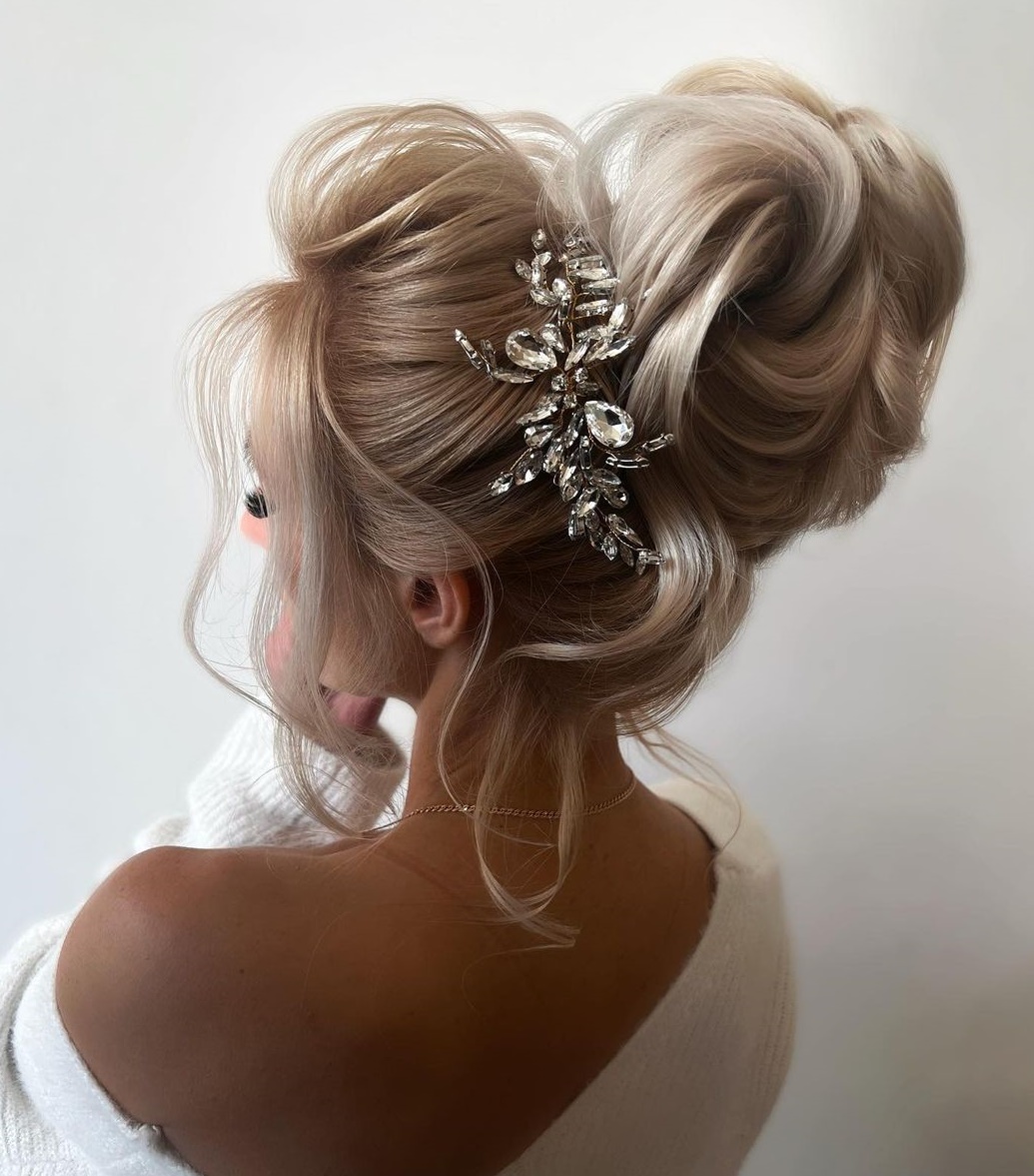 Voluminous Delicate Blonde Bun Updo